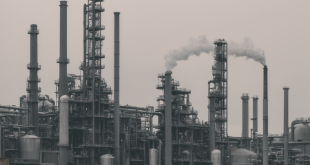 Industrial complex with smoke and towers