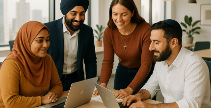 People with laptops in a room