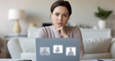 A woman behind a laptop